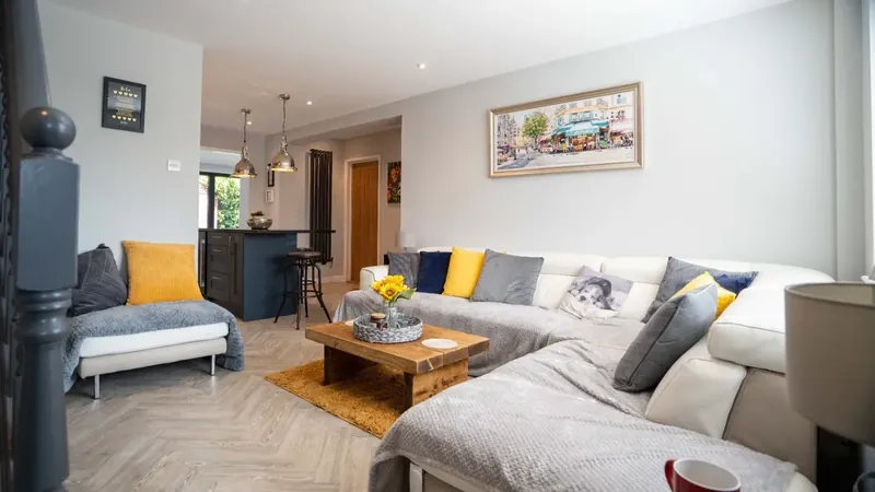 Living space opening onto the kitchen in an extended family home